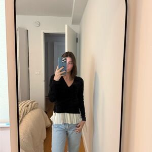 Black sweater with fabric on bottom